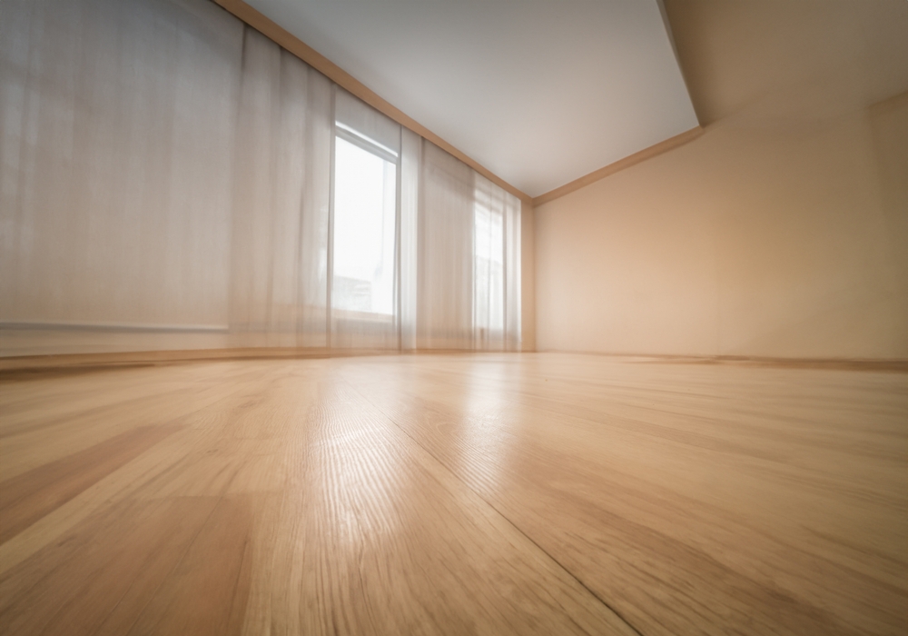 Empty,wooden,floor,closeup,and,room,ceiling,and,doors,with
